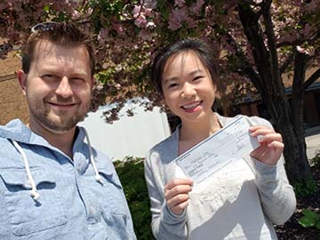 Maegan Ong, Mold Busters Scholarship Winner, Receives Check from Michael Golubev