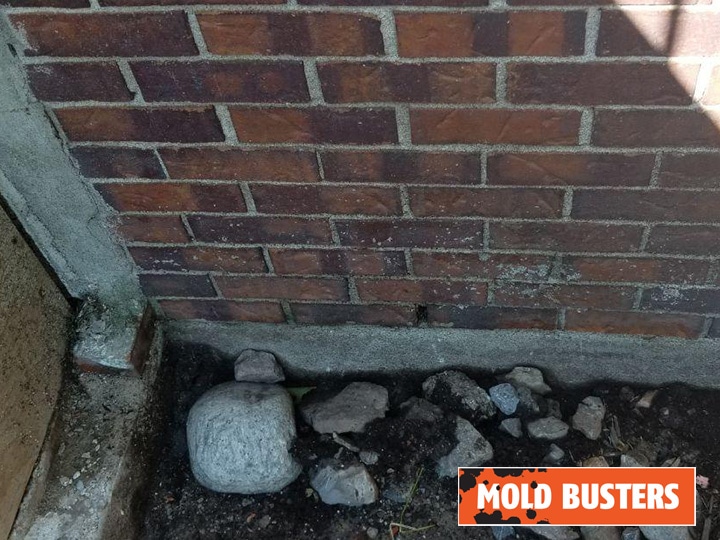 Exterior inspection: mud caked on the walls of the home